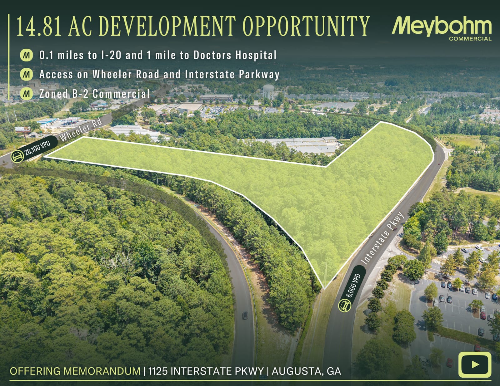 Aerial view of the wooded 14.81-acre site outlined between Wheeler Road and Interstate Parkway